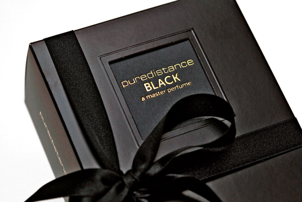 Elegantly packaged Puredistance Black Perfume inside a giftbox with ribbon